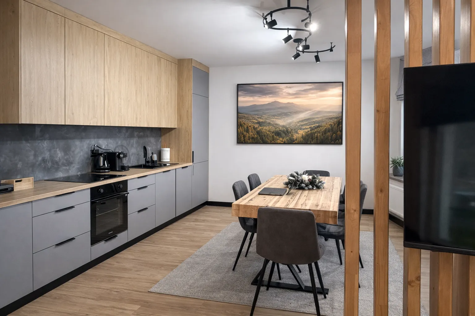 Nowoczesna kuchnia z jadalnią w apartamencie FalHouse